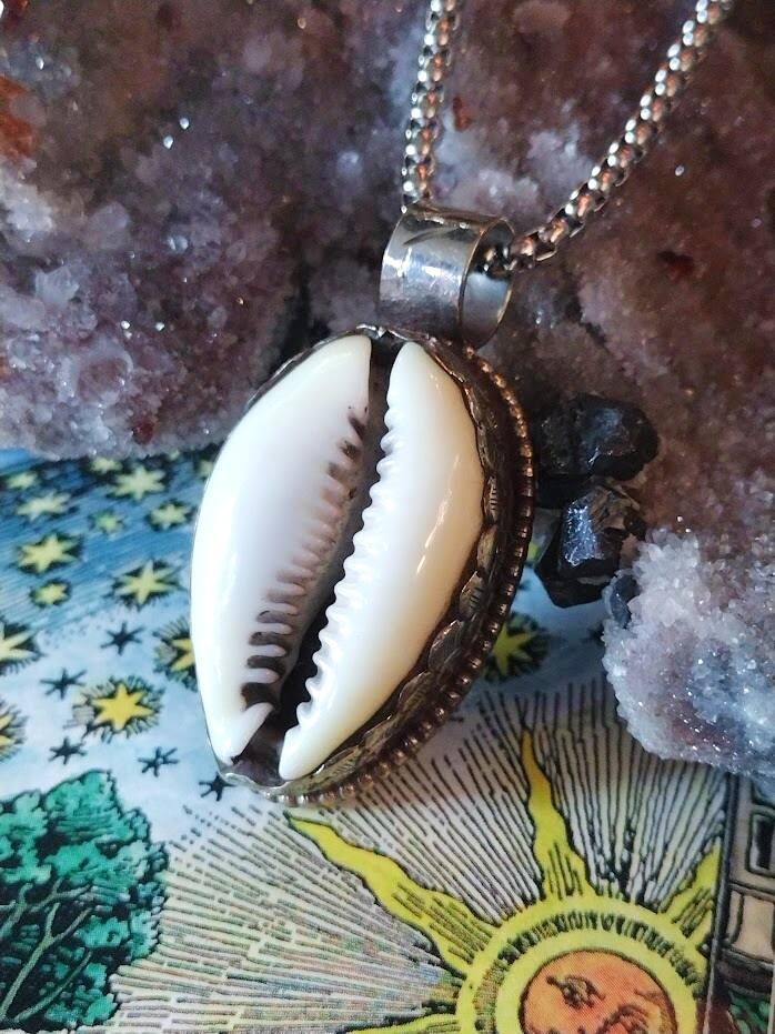 Vodou’s Veil Cowrie Shell Spellbound Talisman of Guidance and Fortune